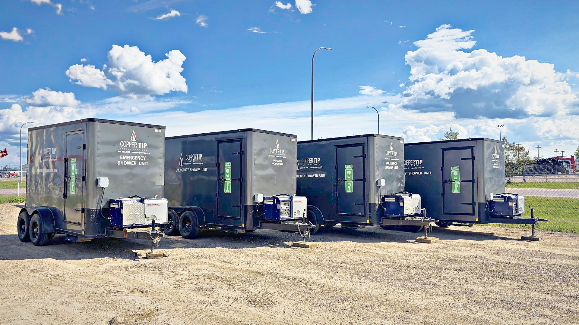 Copper Tip Energy Services emergency shower units lined up in the yard