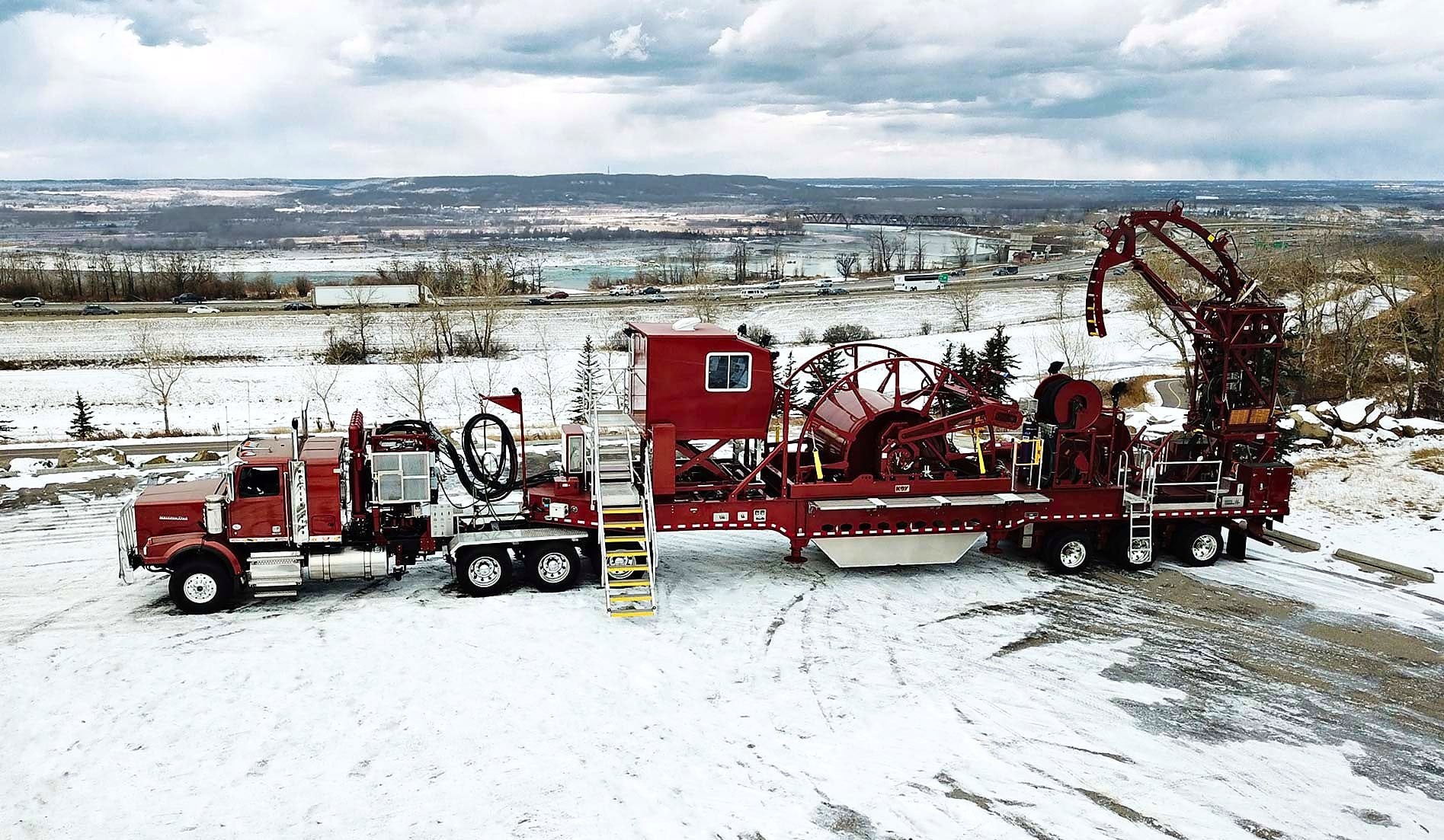Copper Tip Energy Services high capacity coiled tubing unit with valley backdrop