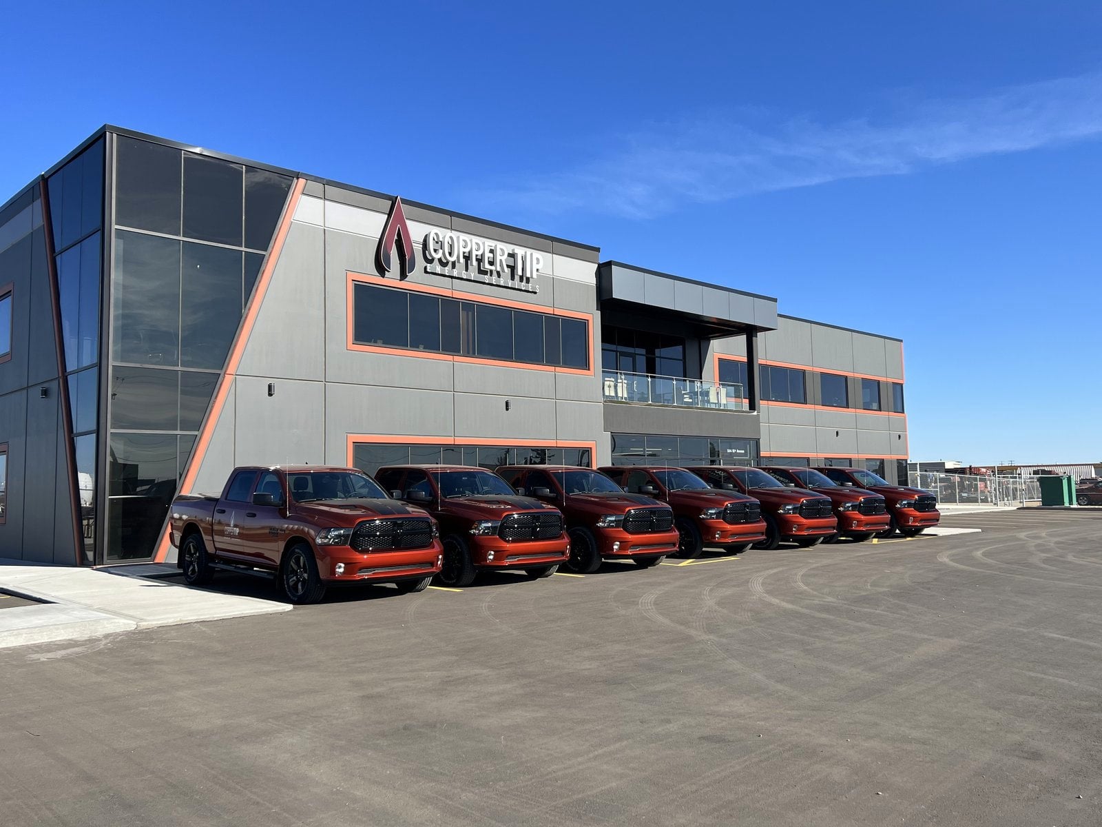 Copper Tip Energy Services Canadian head office in Nisku, Alberta with the company truck fleet parked out front