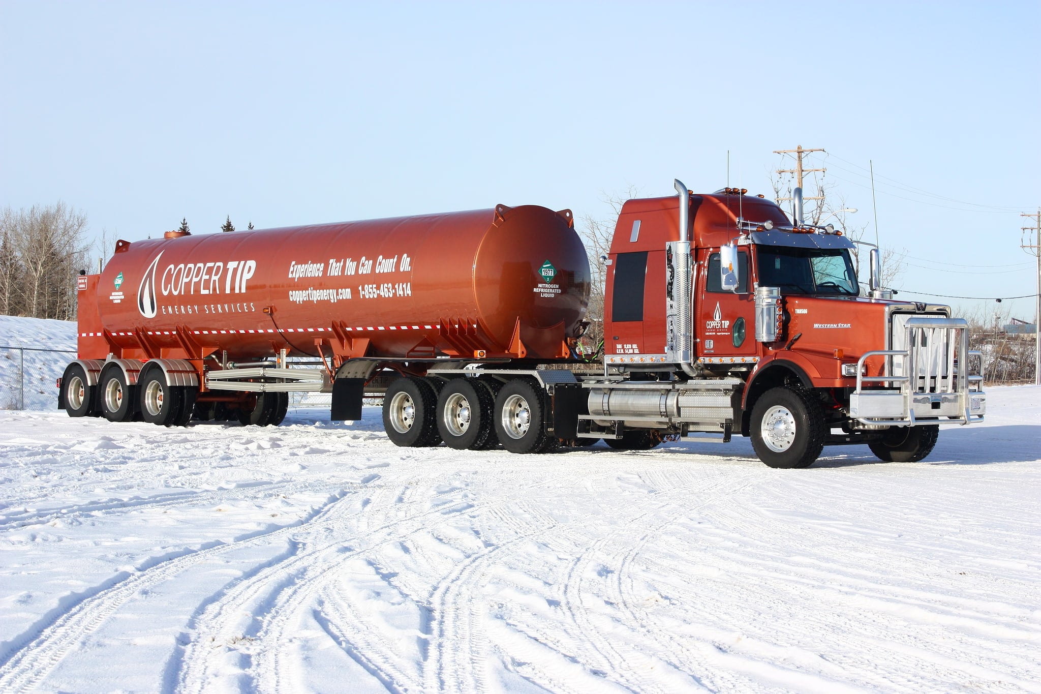 Copper Tip Energy Services bulk transport trailer staged on a snow-covered yard