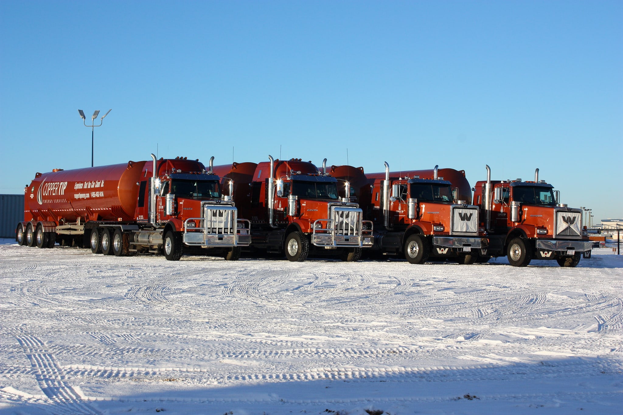 Copper Tip Energy Services nitrogen transport fleet lined up in snow